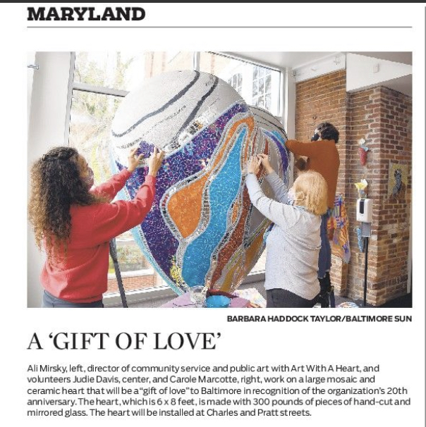 Ali Mirsky and volunteers work on The Heart of Baltimore sculpture in a photo the appeared in the Baltimore Sun